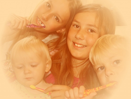 Family having a good time while brushing their teeth