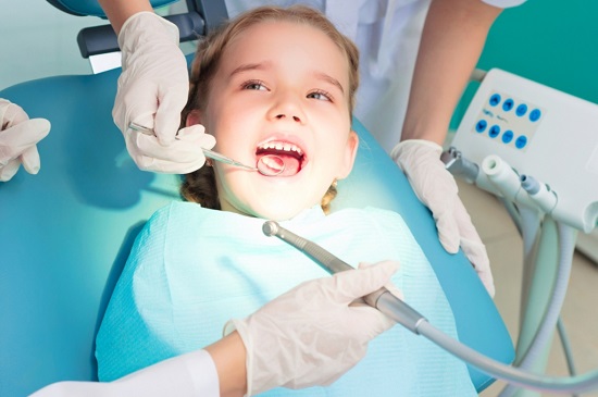 Child during a dentist treatment