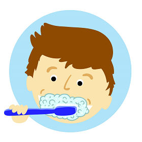 Young child brushing teeth with fluoride toothpaste