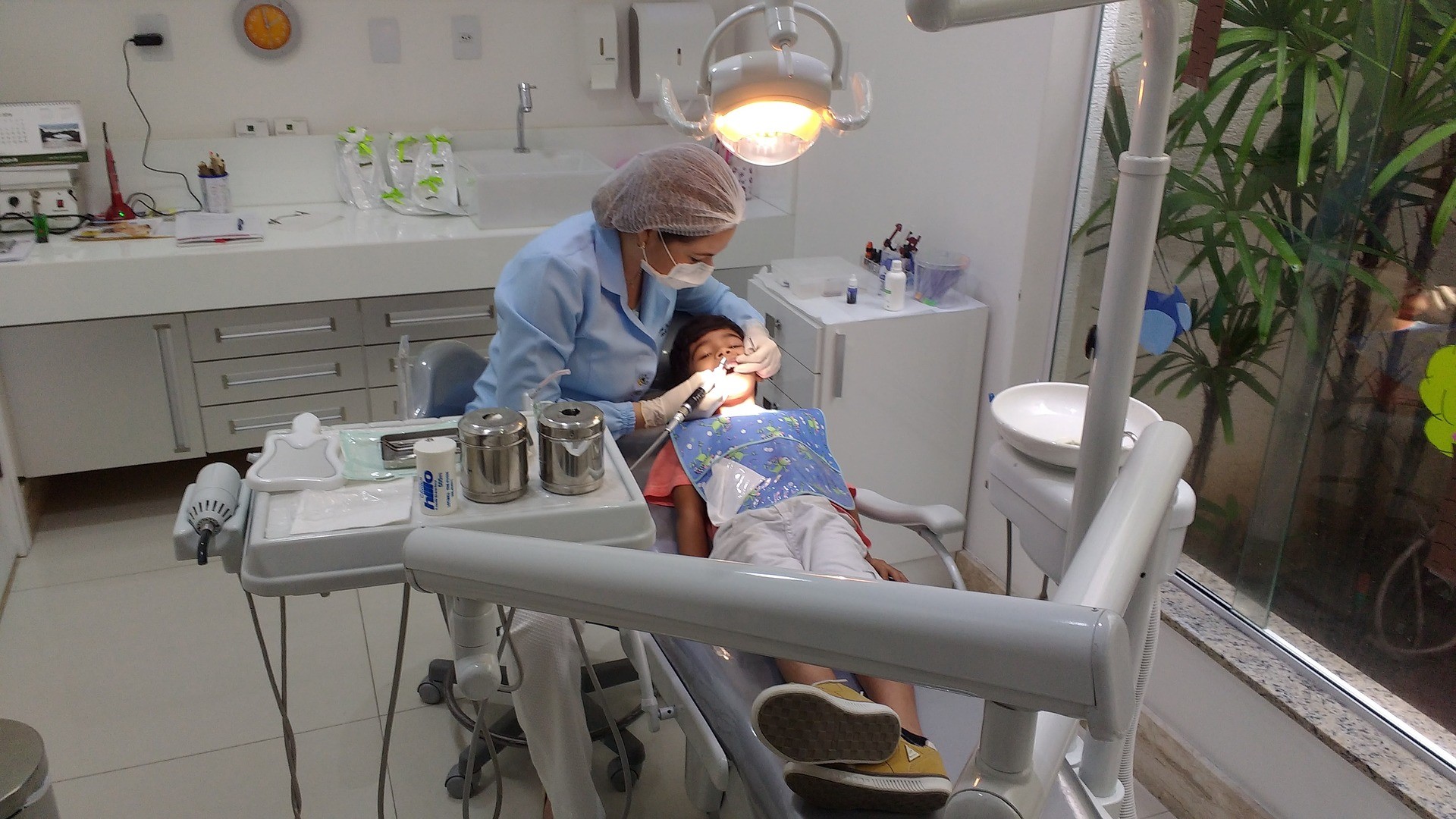 Little kid at the dentist for treatment