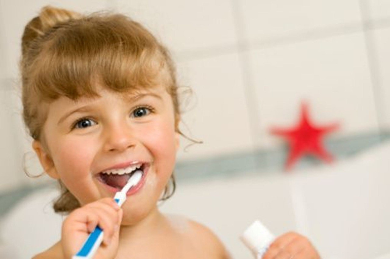 Little girl brushing her teeth