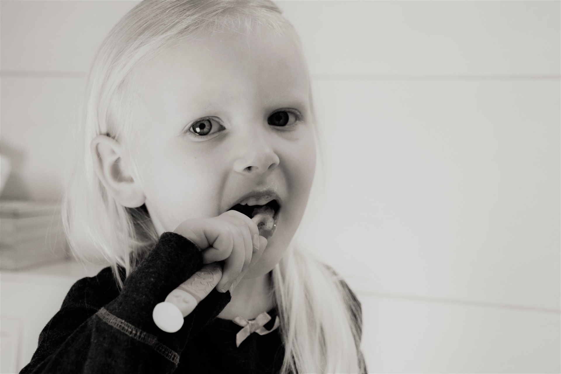 Little girl brushing her teeth