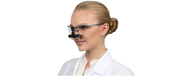Dentist with miscroscope glasses