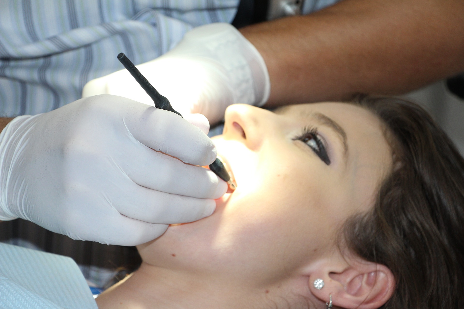 Woman receiving treatment from a dentist