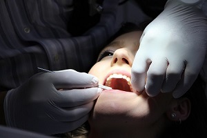 A young girl undergoing a dental treatment
