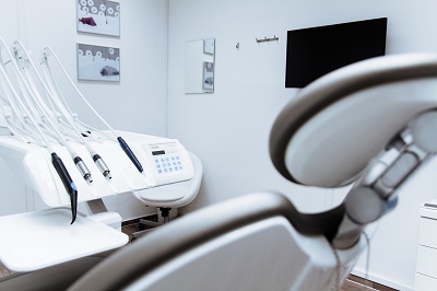 Empty dentist chair ready for treatment with a filling