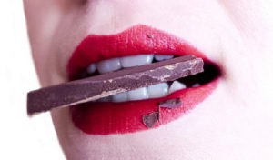 Woman eating chocolate